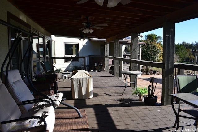 view of patio / terrace with a wooden deck and ceiling fan