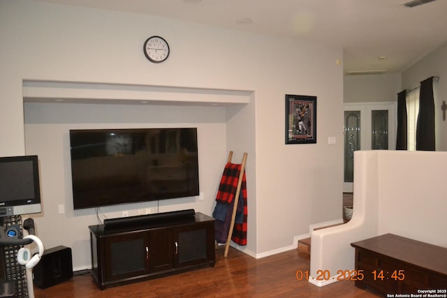 living room featuring dark wood-type flooring