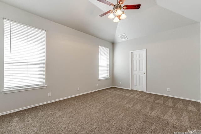 carpeted spare room featuring ceiling fan and lofted ceiling