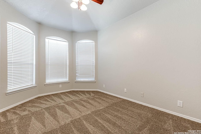 unfurnished room featuring carpet floors and ceiling fan