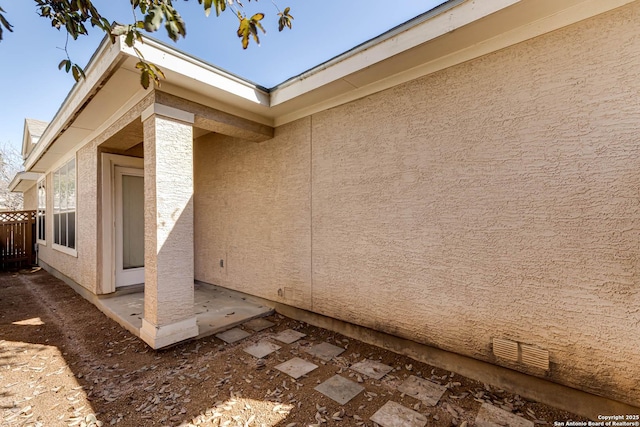 view of side of property featuring a patio