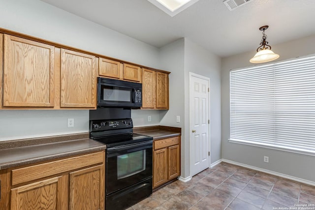 kitchen featuring hanging light fixtures and black appliances