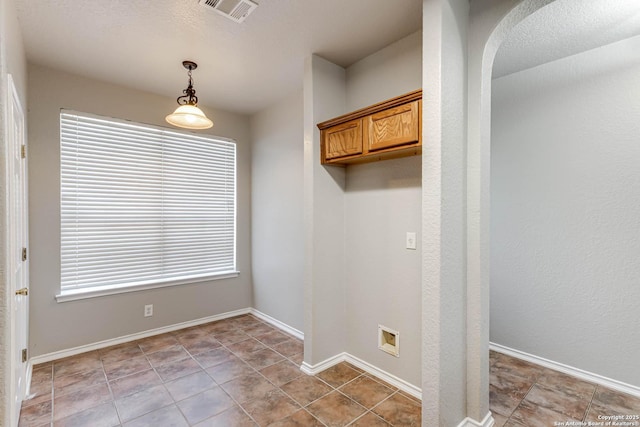 washroom with plenty of natural light and tile patterned floors