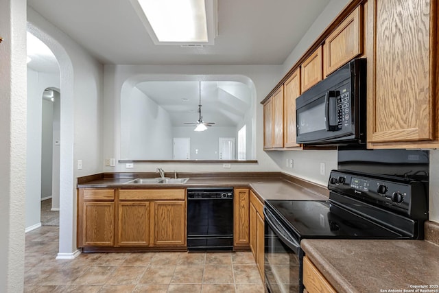 kitchen featuring lofted ceiling, sink, ceiling fan, black appliances, and light tile patterned flooring