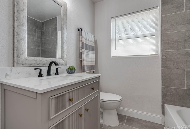 bathroom featuring vanity, tile patterned floors, and toilet