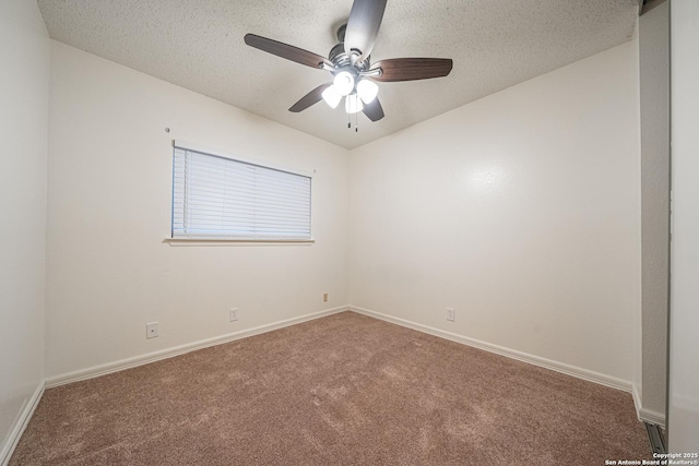 unfurnished room featuring ceiling fan, carpet, and a textured ceiling