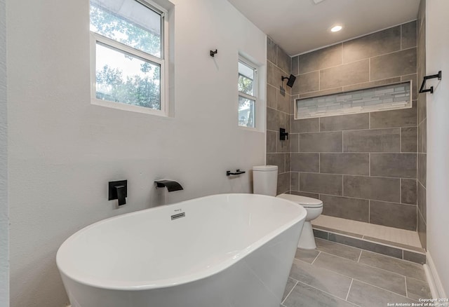 bathroom with plenty of natural light, tile patterned floors, independent shower and bath, and toilet