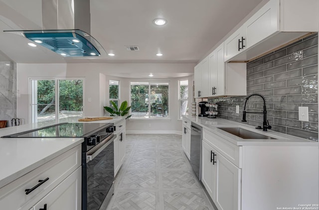 kitchen featuring sink, range with electric cooktop, white cabinets, island exhaust hood, and stainless steel dishwasher