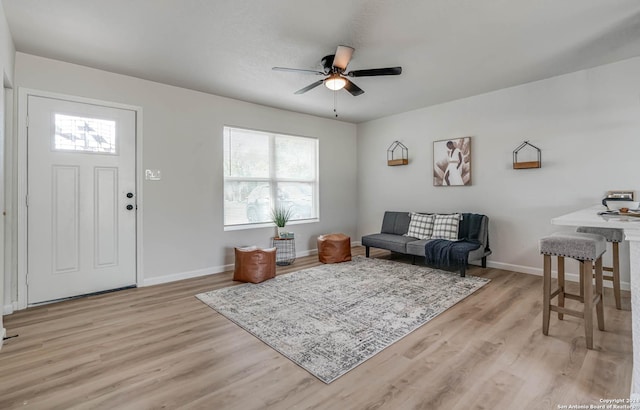 interior space featuring ceiling fan and light wood-type flooring