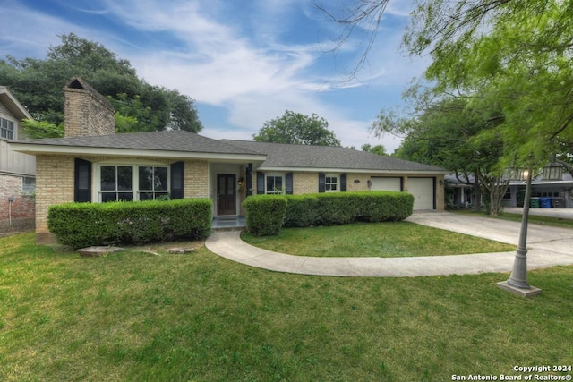 single story home with a garage and a front yard