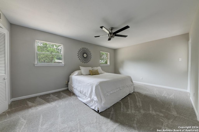 carpeted bedroom with ceiling fan