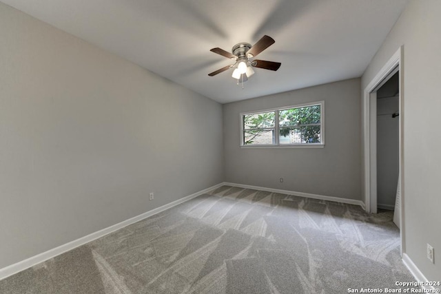 unfurnished bedroom featuring carpet flooring and ceiling fan