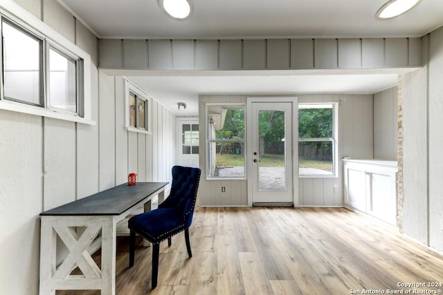 office with light wood-type flooring