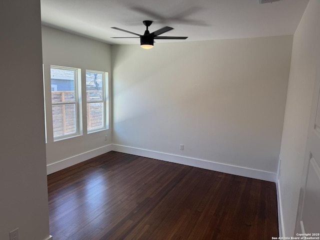 unfurnished room featuring dark hardwood / wood-style flooring and ceiling fan