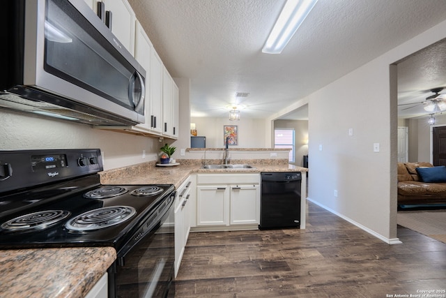 kitchen with black appliances, sink, white cabinets, kitchen peninsula, and a textured ceiling