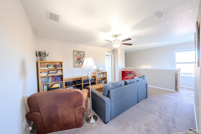 living room with ceiling fan and light carpet