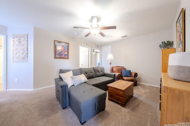 living room with ceiling fan and light carpet