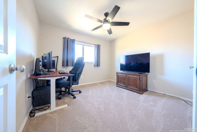 home office featuring light colored carpet and ceiling fan