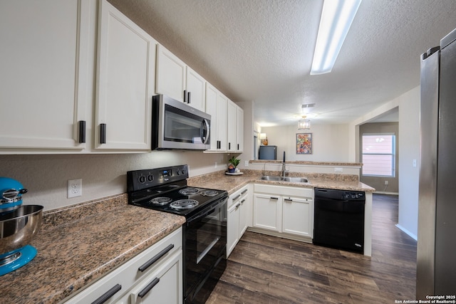 kitchen featuring black appliances, sink, white cabinets, dark hardwood / wood-style flooring, and kitchen peninsula