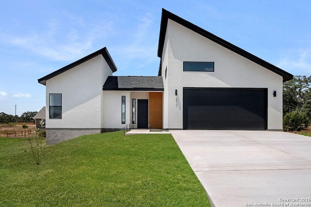 contemporary house with a garage and a front lawn