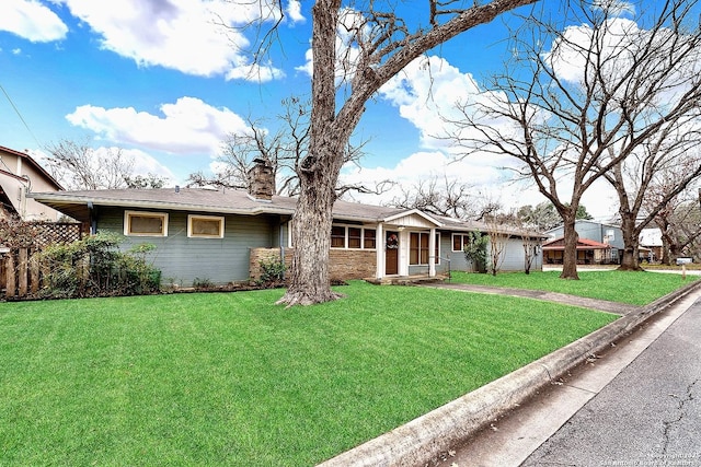 single story home featuring a front yard