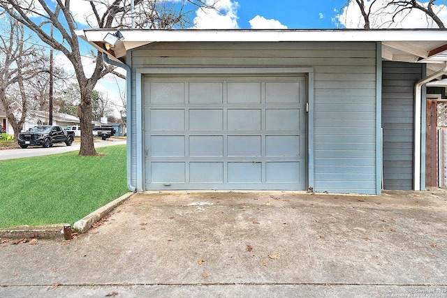 garage featuring a yard