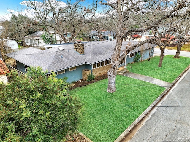 ranch-style house with a front yard