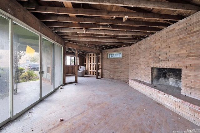 miscellaneous room featuring an outdoor brick fireplace and brick wall