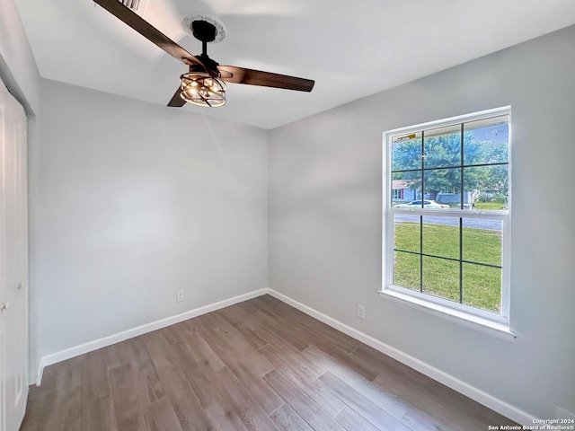 unfurnished room featuring hardwood / wood-style flooring and ceiling fan