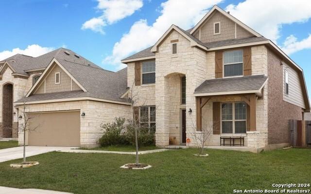 view of front facade with a garage and a front yard