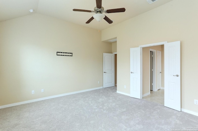 unfurnished bedroom with vaulted ceiling, light carpet, and ceiling fan