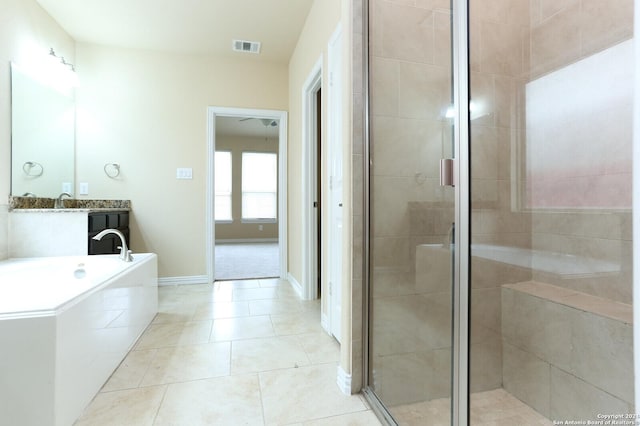 bathroom with tile patterned flooring, vanity, and independent shower and bath