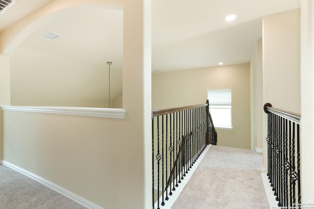 hallway with light carpet