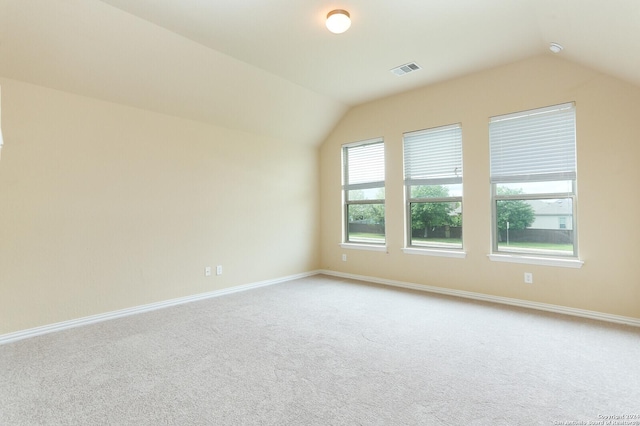 bonus room featuring vaulted ceiling and carpet floors