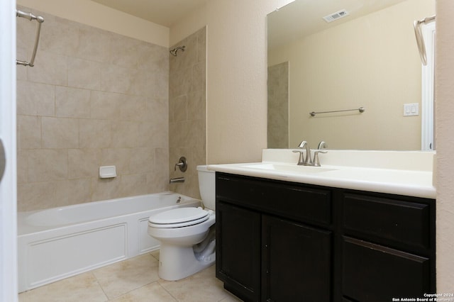 full bathroom with vanity, toilet, tiled shower / bath combo, and tile patterned flooring