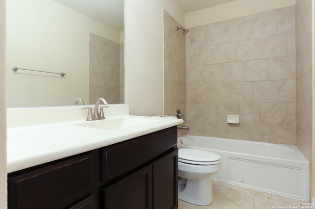 full bathroom featuring vanity, toilet, tiled shower / bath combo, and tile patterned flooring