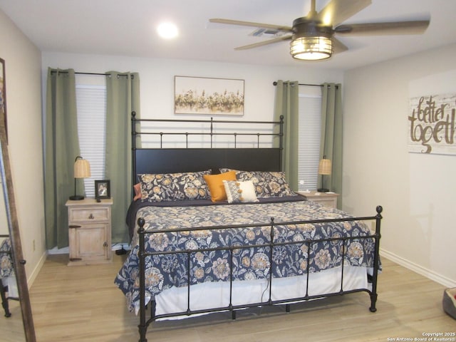 bedroom featuring wood-type flooring and ceiling fan