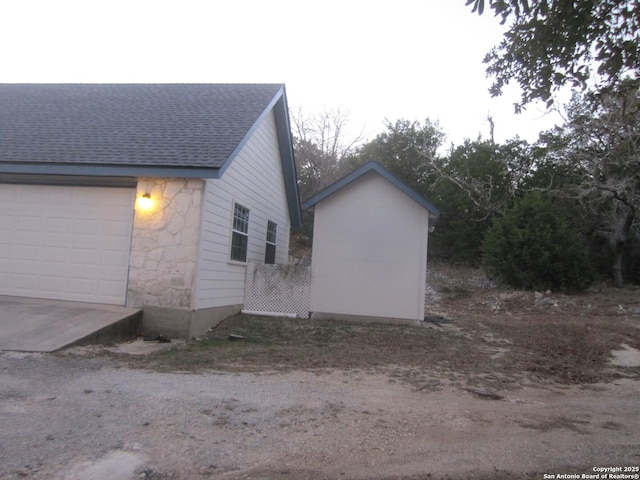 view of side of home with a garage