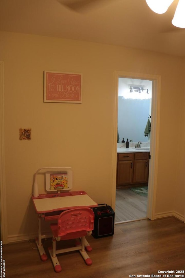 interior space with sink and hardwood / wood-style floors