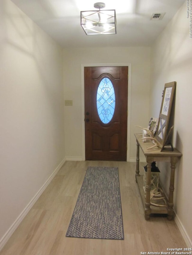 entryway with light hardwood / wood-style flooring