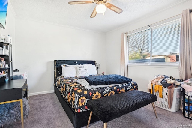 carpeted bedroom featuring ceiling fan, crown molding, and a textured ceiling