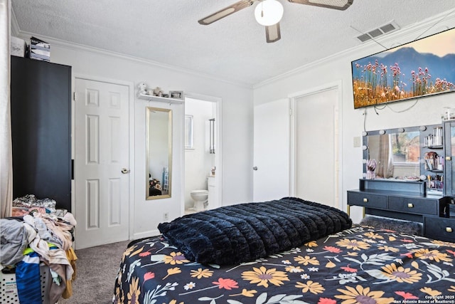 bedroom featuring ensuite bathroom, carpet, ceiling fan, crown molding, and a textured ceiling