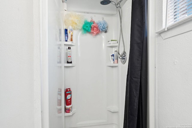 bathroom with a shower with shower curtain