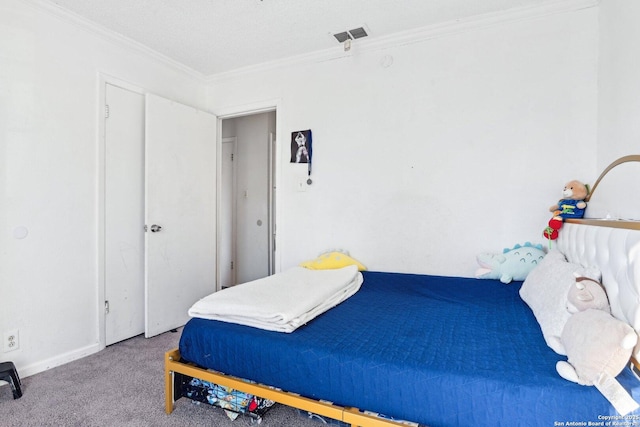 bedroom with crown molding and carpet floors