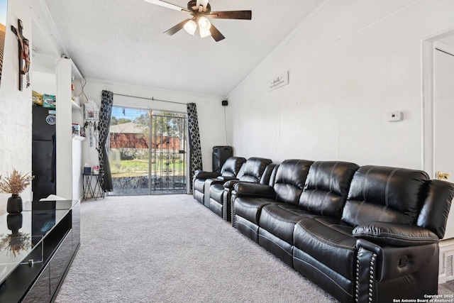 carpeted living room with crown molding, ceiling fan, and vaulted ceiling