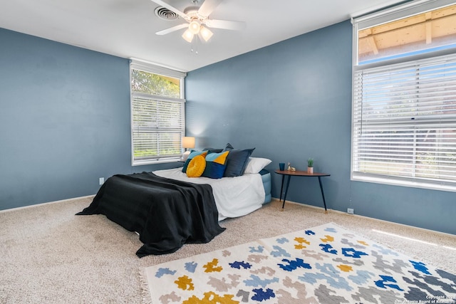 carpeted bedroom with ceiling fan