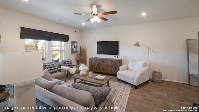 living room with wood-type flooring and ceiling fan