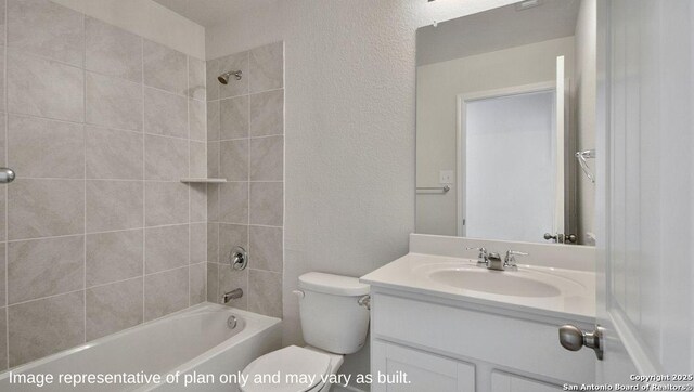 full bathroom with vanity, toilet, and tiled shower / bath