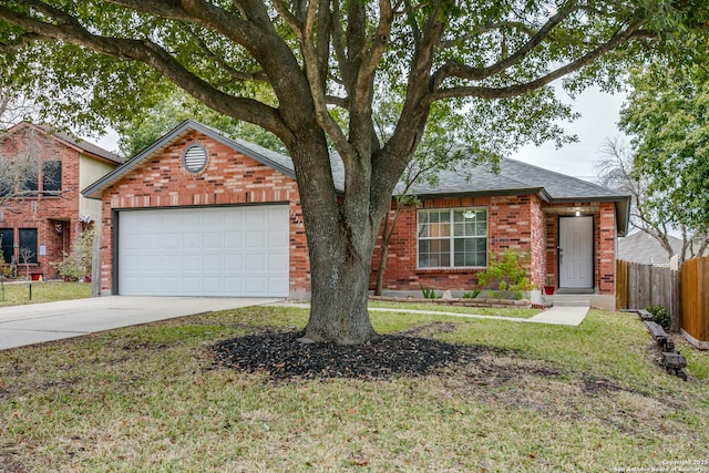 view of front facade with a garage and a front yard