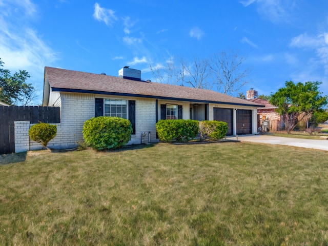 single story home with a garage and a front yard